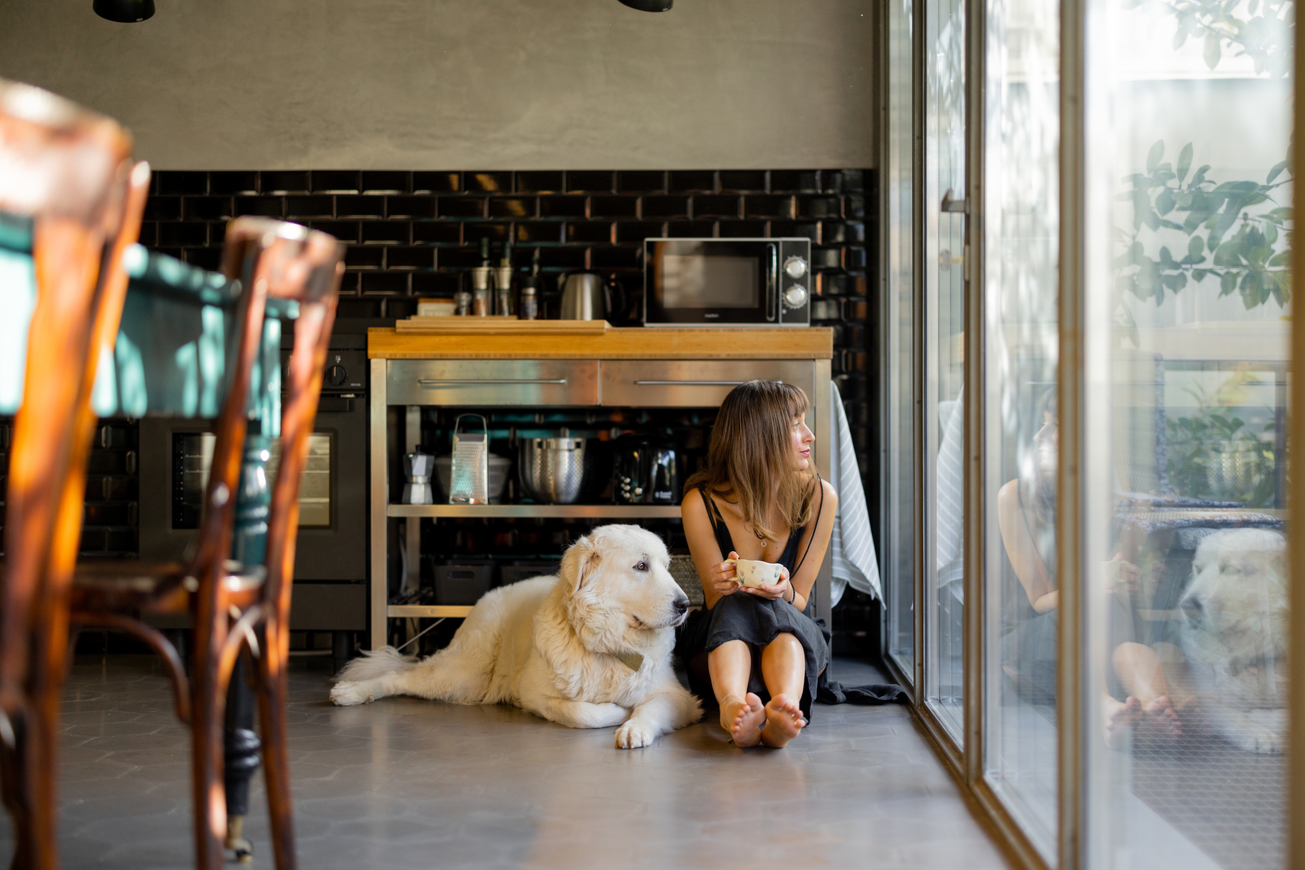 Woman and Dog Relaxing in Cozy Kitchen